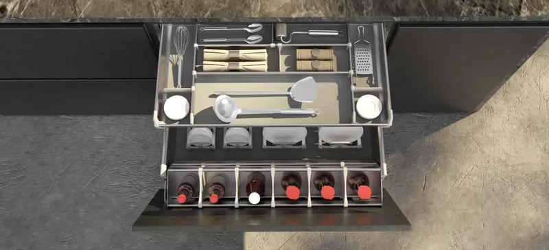 Catalogue image: pull-out dish basket with cutlery tray and bottle rack under a counter