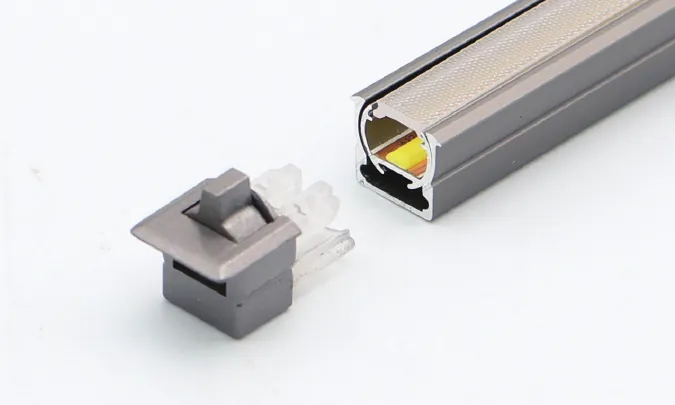 Catalogue image: rotating recessed linear light profile with end cap and connector