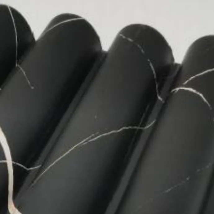 Catalogue image: black marble-effect wall panel with large half-round flutes